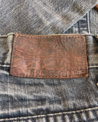 Tornado Mart Snakeskin Trim Side Lace-Up Panel Flare Denim Jeans