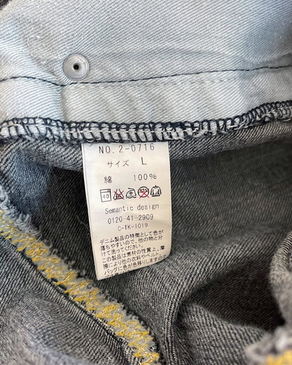 Semantic Design Python Pocket Sword Flare Distressed Denim Jeans