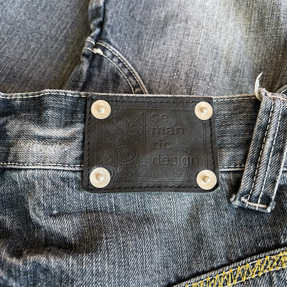 Semantic Design Python Pocket Sword Flare Distressed Denim Jeans